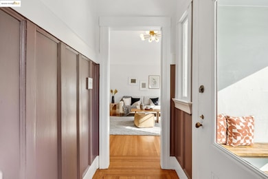 Hallway featuring light wood-style flooring