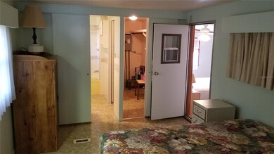 Master bedroom, with walk in closet. Door to famil