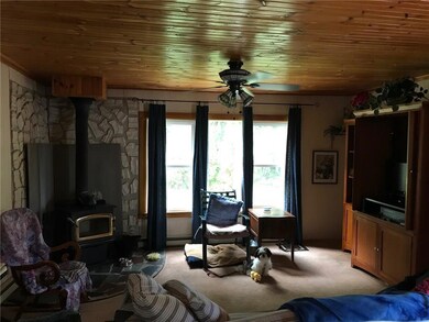 large living area with wood stove