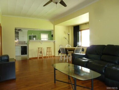 Open dining and living area gives a spacious feel with natural lighting lending to the warm cheerfulness of the space.