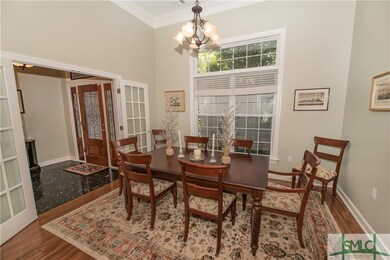 formal dining room with French doors, high ceiling