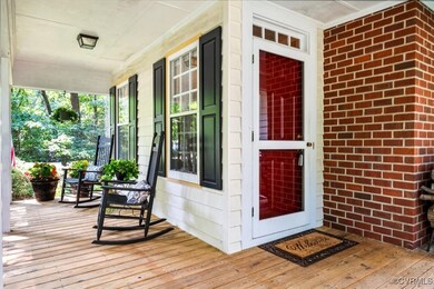 Entrance to property featuring a porch