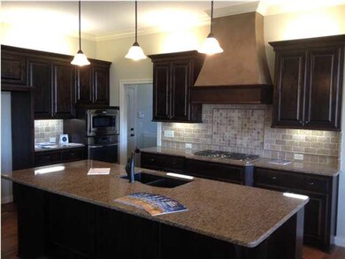 Alder Cabinetry, Hickory Wood Floor and Granite Co
