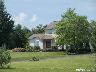 Exterior Front. There are light posts that help se