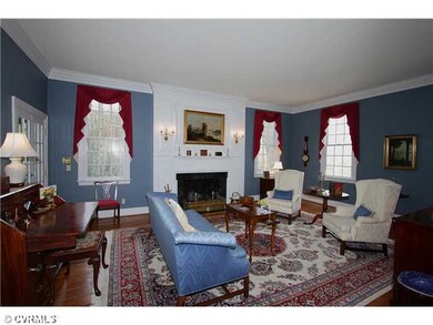 Living Room - wide plank oak floor,brick fireplace