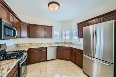 Kitchen with a sink, stainless steel appliances, l