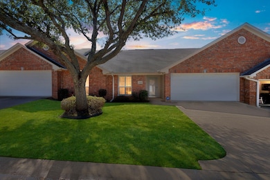 Single story home featuring a garage, driveway, br