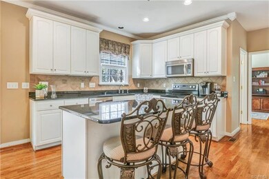 Kitchen - hardwood floors, center island, granite,
