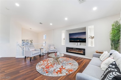 Living area featuring visible vents, recessed ligh