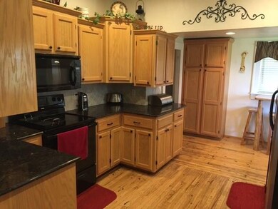Updated kitchen with granite counters, lots of cab