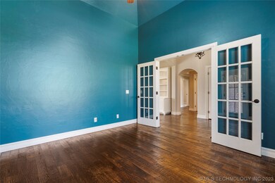 Formal office with hand-scraped hardwood floors an