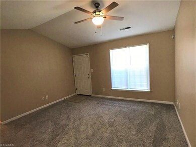As you enter, you will see the cathedral ceiling in the living room.