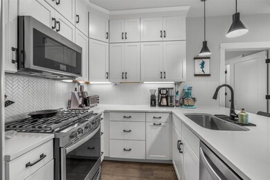 Kitchen featuring stainless steel appliances, a s