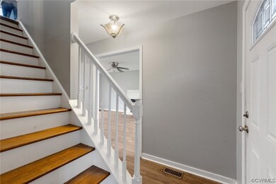 FOYER ~ WITH COAT CLOSET AND WOOD STAIRS, LOOKING