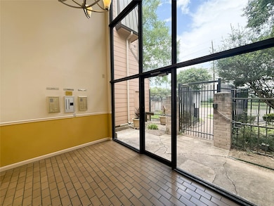 Bright entryway with large windows and a high ceil