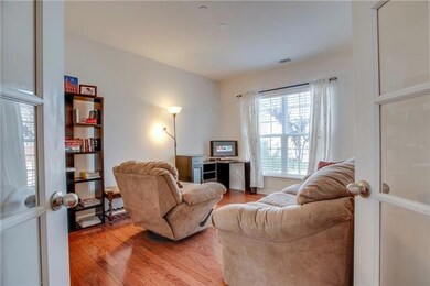 11' x 13' office offering french doors and hardwood floors.