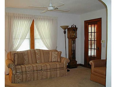 Living Room. Living room has carpeting, a wood doo