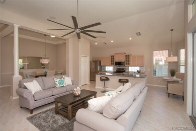 Formal dining area with solar tube, kitchen and gr