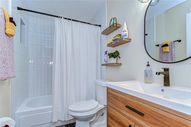 Fully renovated bathroom with a shower/tub feature