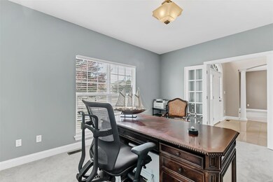 French doors lead into office off the front entry!