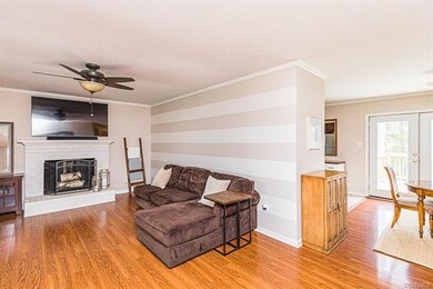 FAMILY ROOM W/ HW FLOORS, CEILING FAN, CROWN, FIRE