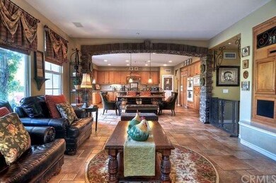 Open Great Room with custom stone arch