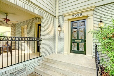 As you approach the front door of the home, take n