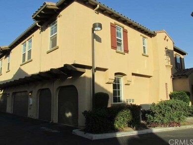 Exterior corner lot with double garage doors.