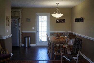 Dinning room opens to kitchen and living. Tiled floors. Leads to large deck.