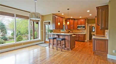 Kitchen with hardwoods, granite counter tops, pant