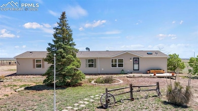 Rear view of house featuring fence