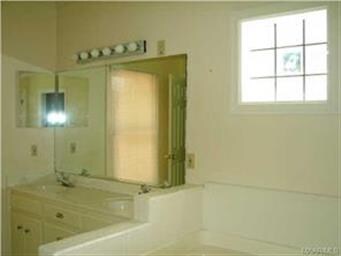 Master bath features a garden tub and separate sho