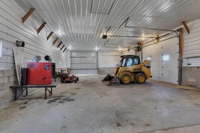 The shed has insulated walls, but the ceiling has not been insulated. The wood furnace in shed can stay.