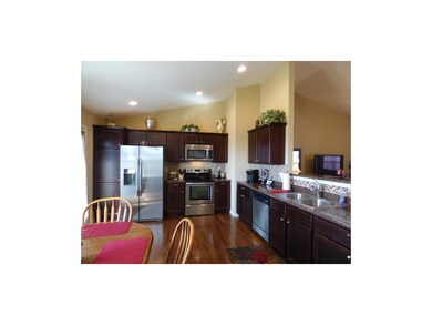 Beautiful darker hardwoods in pristine condition!