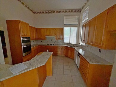 Kitchen featuring a sink, tasteful backsplash, ve