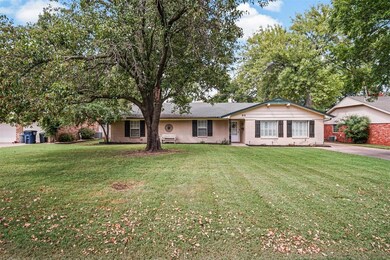 Single story home with a front lawn and central ai