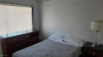 Bedroom with multiple windows