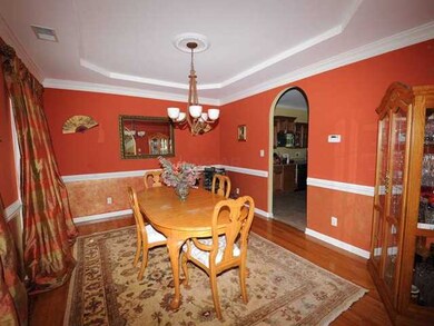 The custom window treatment , crown and chair rail