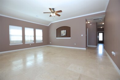 Another view of the family room, with crown molding and vaulted ceilings.
