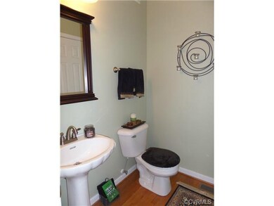 1/2 Bath downstairs with hardwood floors