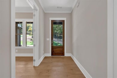 Engineered hardwood and crown molding throughout m