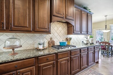 Open concept kitchen with tile backsplash