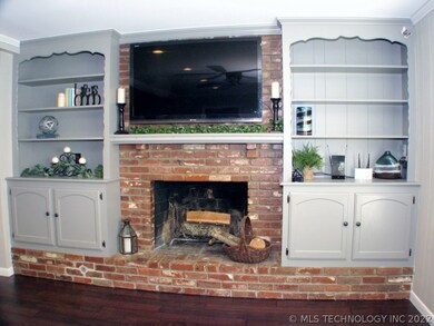 The nice-sized wood-burning fireplace centers the
