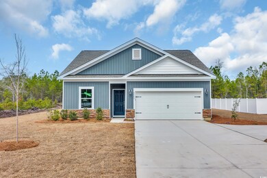 Craftsman-style house with fence, concrete drivewa
