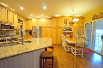 Open kitchen with breakfast bar.