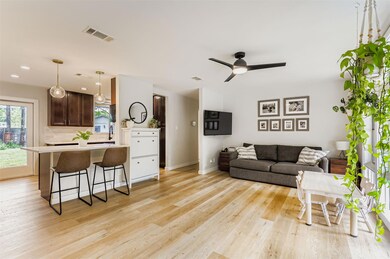 Living area featuring light wood-type flooring, c
