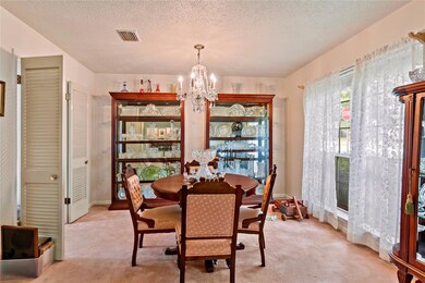 Dining space with an inviting chandelier, light ca