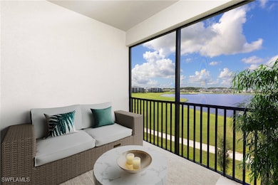 Balcony of corner unit featuring a tranquil water