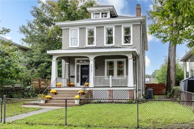 View of front facade with a porch, central AC, and