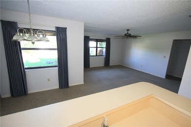 Kitchen overlooks informal DR & Family Rm